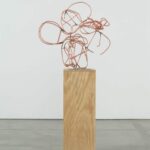 christopher wool wire sculpture on wooden pedestal